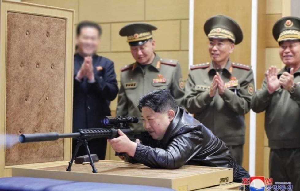North Korean leader visits arms factory tries new national made sniper rifle